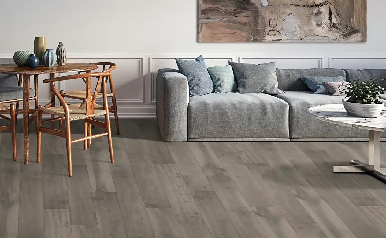 Living room with soft grey and wood furniture and carpet.